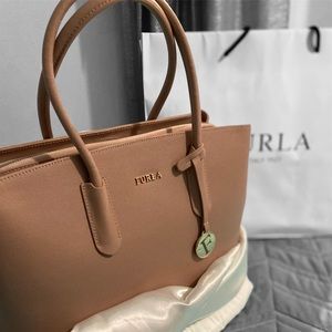 Furla bag, neutral color. Was a gift, never got to use. Opened for pictures.